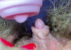 Wow, check out this big clitoris on a hairy pussy in extreme closeup!