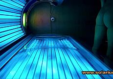 Beautiful woman masturbates on solarium cam