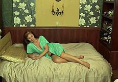 Hey, check out my mature wife giving me that handjob in her light-blue night dress