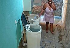 hidden camera catches stepmom showering and showing off big natural tits in the backyard