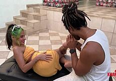 Brunette gives footjob and gets messy