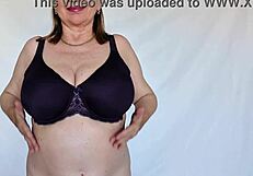 Busty granny Mariaolds shows off natural tits in stockings.