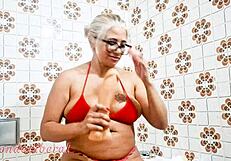 Blonde milf inserts dildo in pussy during homemade session. She then pisses in bathroom for exhibitionist thrill.