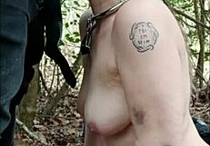 Female Slave Walking In Forest For Dogging