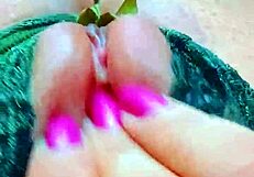 Intensely fingering her strawberry pink shaved pussy to wet orgasm.