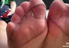 goddess teases with tan nylon soles and toes by the riverside, close-up fetish delight