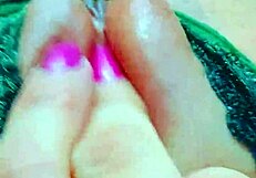 Intensely fingering her strawberry pink shaved pussy to wet orgasm.