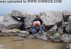 Watch This Milf Pissing In The Sea With Her Hairy Pussy!