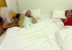 Girlfriend sneaks into swinger couple bedroom to fuck husband 😏