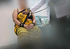 Doctor examines patient thoroughly in clinic setting