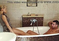 footjob leads to a deep fuck against the sink for this cute blonde