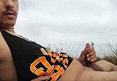 Guy on nude beach spills a lot of milk