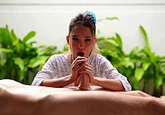 a small 18+ asian woman massages a big penis, moaning in quickie