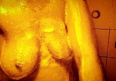 Horny milf enjoys slow motion shower massage