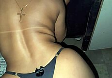 I grind my ass on the black guy's cock and he cums in my hand at the glory hole.