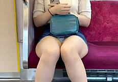 Chinese woman in skirt exposes panties during upskirt on crowded train