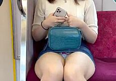 Chinese woman in skirt exposes panties during upskirt on crowded train