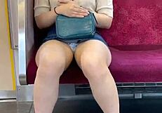 Chinese woman in skirt exposes panties during upskirt on crowded train