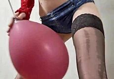 In the dungeon, mistress elza kom worships balloons with her sexy curves and domination skills