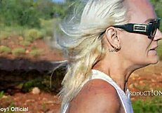 Girl Soaks Jeans While Hiking Barefoot in Wet Outdoor Public Area Near Beach