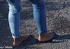 Girl Soaks Jeans While Hiking Barefoot in Wet Outdoor Public Area Near Beach