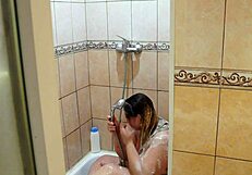 Chubby milf washes and shaves in shower