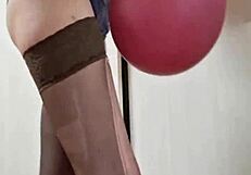 In the dungeon, mistress elza kom worships balloons with her sexy curves and domination skills