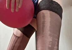 In the dungeon, mistress elza kom worships balloons with her sexy curves and domination skills