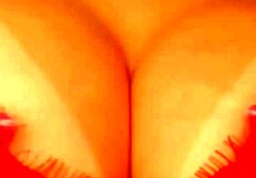 brunette engaging in extreme teasing with tits and butt plug