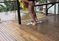 Is this shameless young wife getting fucked on the porch by her husband?