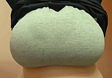 Feeling the weight of huge tits