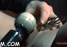 bound in sadomasochism, she licks balls under electric shocks