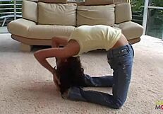 Sexy flexible brunette displays amazing body, performs anal stretches.