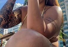 African woman feels excitement flashing on beach