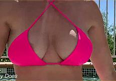 Wife flashes her big tits in the hotel pool for exhibitionist fun.