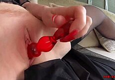 i'm red, a mature babe, using a glass dildo on my tight cunt outdoors in lingerie and heels