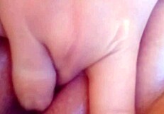 feeling the wetness of her pink pussy while masturbating