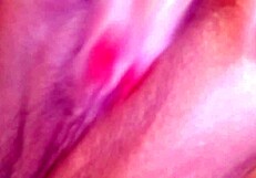 feeling the wetness of her pink pussy while masturbating