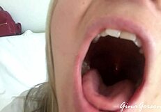 A young skinny blonde amateur explores homemade tongue and saliva techniques with a teen friend in a casual setting