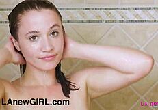 Adorable teen model poses sensually in shower photoshoot