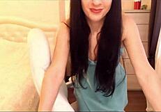 small tit brunette strips teasingly in chair