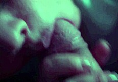 A prurient woman passionately sucks her paramour's cock, gagging and swallowing deeply in a sloppy homemade blowjob.
