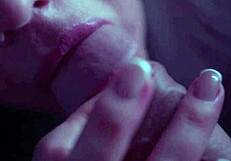A prurient woman passionately sucks her paramour's cock, gagging and swallowing deeply in a sloppy homemade blowjob.
