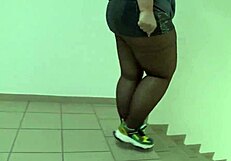 public foot fetish features fat legs in nylon on mall stairs under skirt