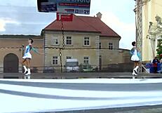 two nice majorettes perform cheerleading routines