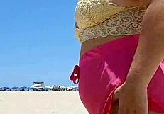 Beach lover flashes pussy to make him hard.