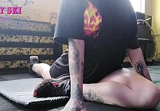 Alternative girl stretching at the gym?