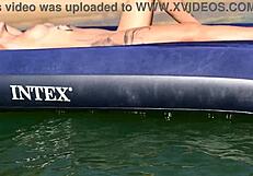 nude blonde beauty exposes big boobs on public beach with dolphin tattoo