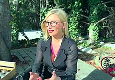 Irina's big tits contrast as she plays with a cock