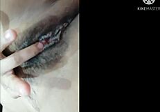 she fingers her wet pussy frantically until she explodes in orgasm